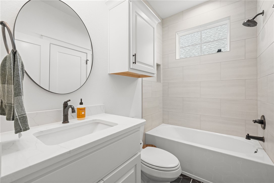 5034 Toscana Loop Bryan, TX 77802 - Photo 16 of 41 a bathroom with a sink a toilet and bathtub