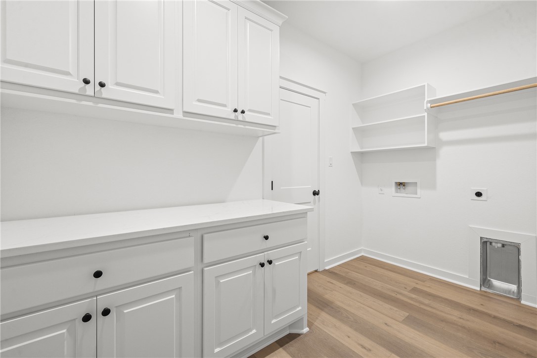 5034 Toscana Loop Bryan, TX 77802 - Photo 17 of 41 a view of white cabinets and window