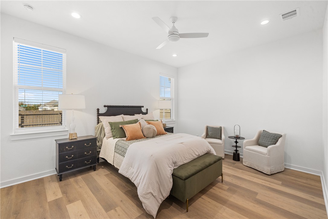 5034 Toscana Loop Bryan, TX 77802 - Photo 18 of 41 a bedroom with two beds and a couch