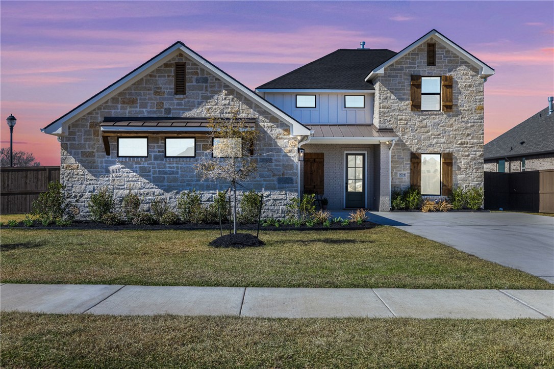 5034 Toscana Loop Bryan, TX 77802 - Photo 34 of 41 a front view of a house with a yard