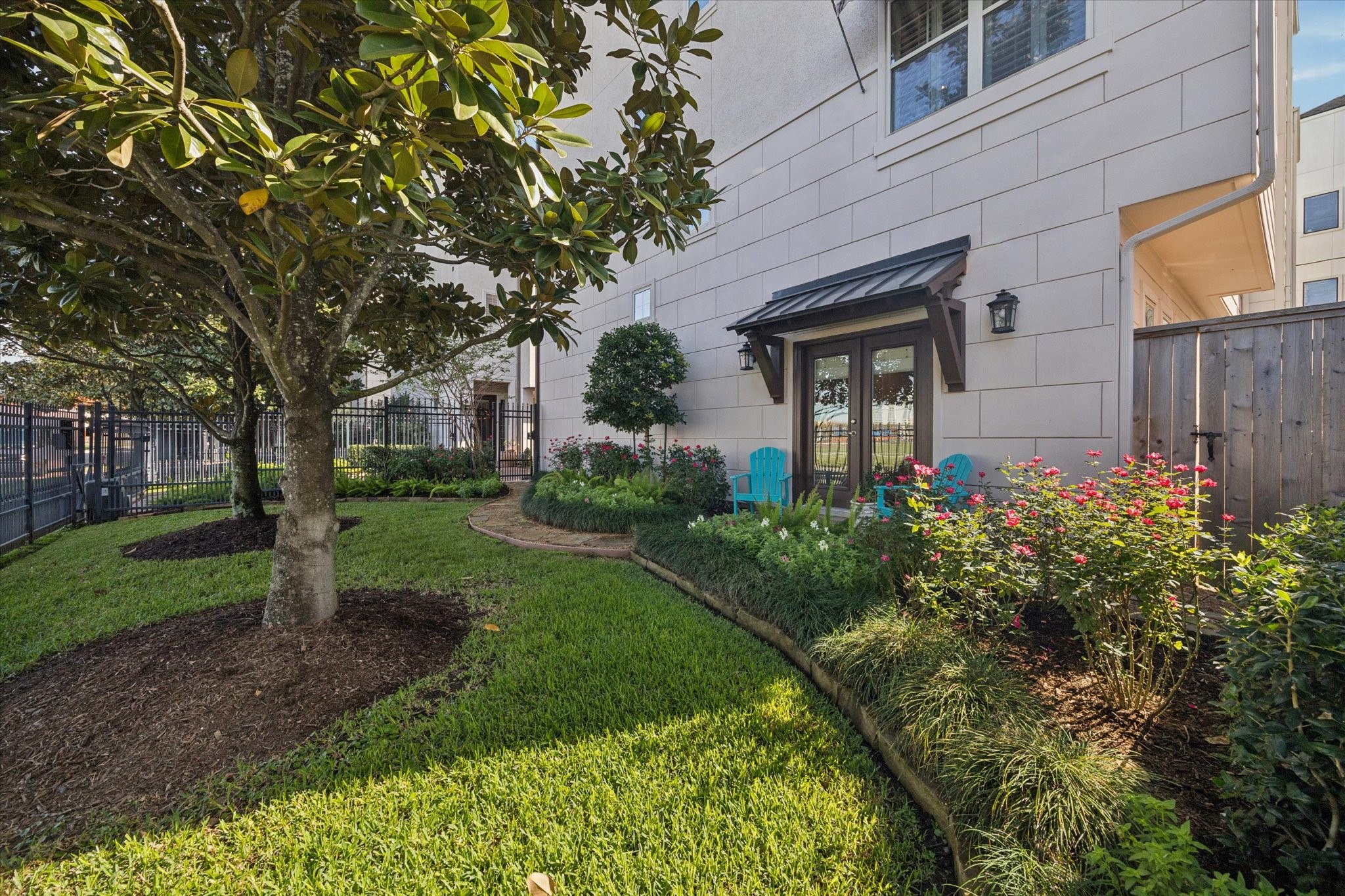 Private fenced front yard accessible from the first floor bedroom/office