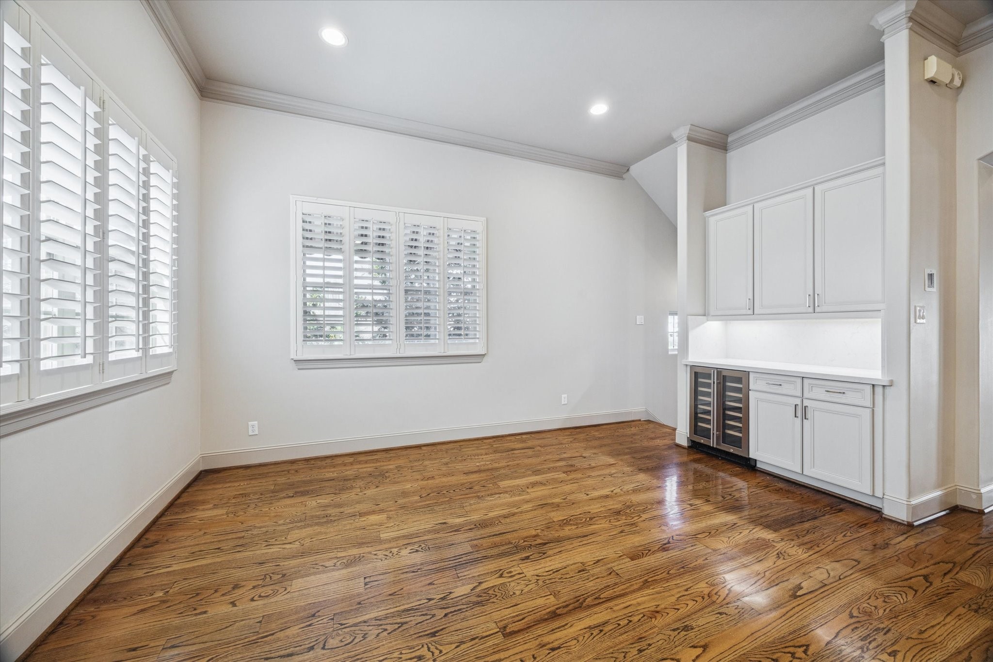 1545 Haddon Street Houston, TX 77006 - Photo 18 of 30 a view of an empty room with window and wooden floor