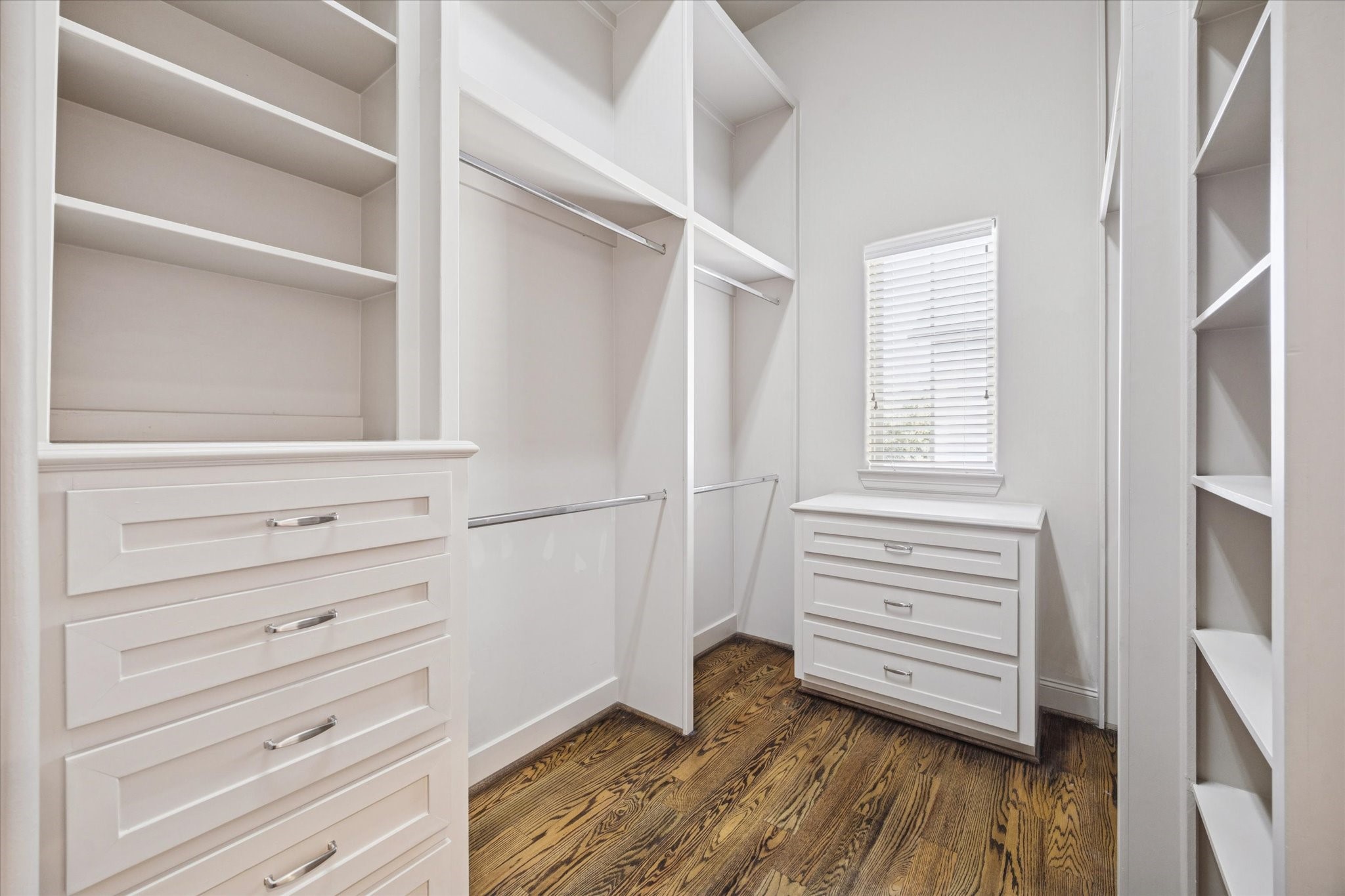 1545 Haddon Street Houston, TX 77006 - Photo 27 of 30 a view of walk in closet with empty racks