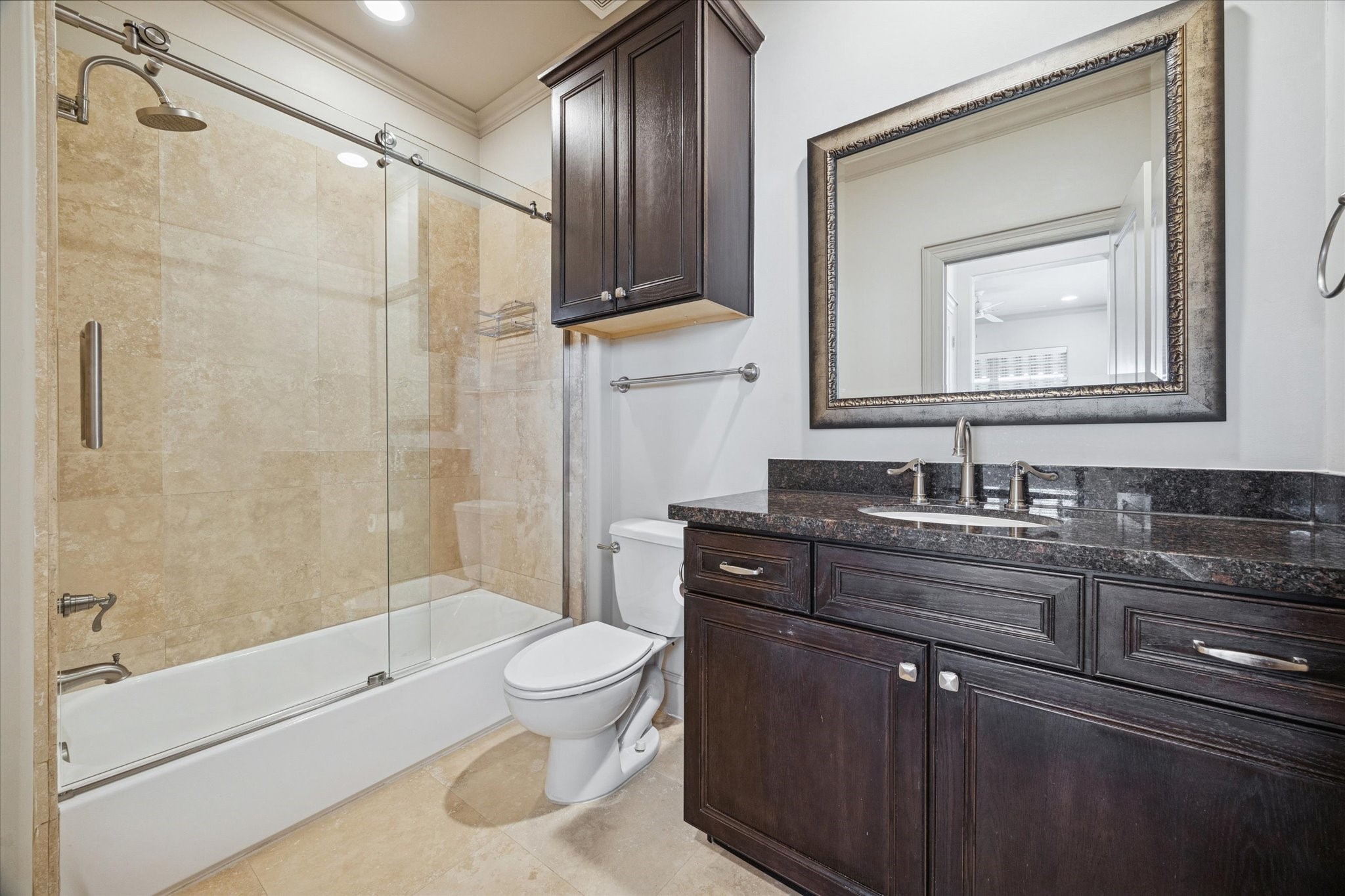 1545 Haddon Street Houston, TX 77006 - Photo 29 of 30 a bathroom with a granite countertop toilet sink and mirror