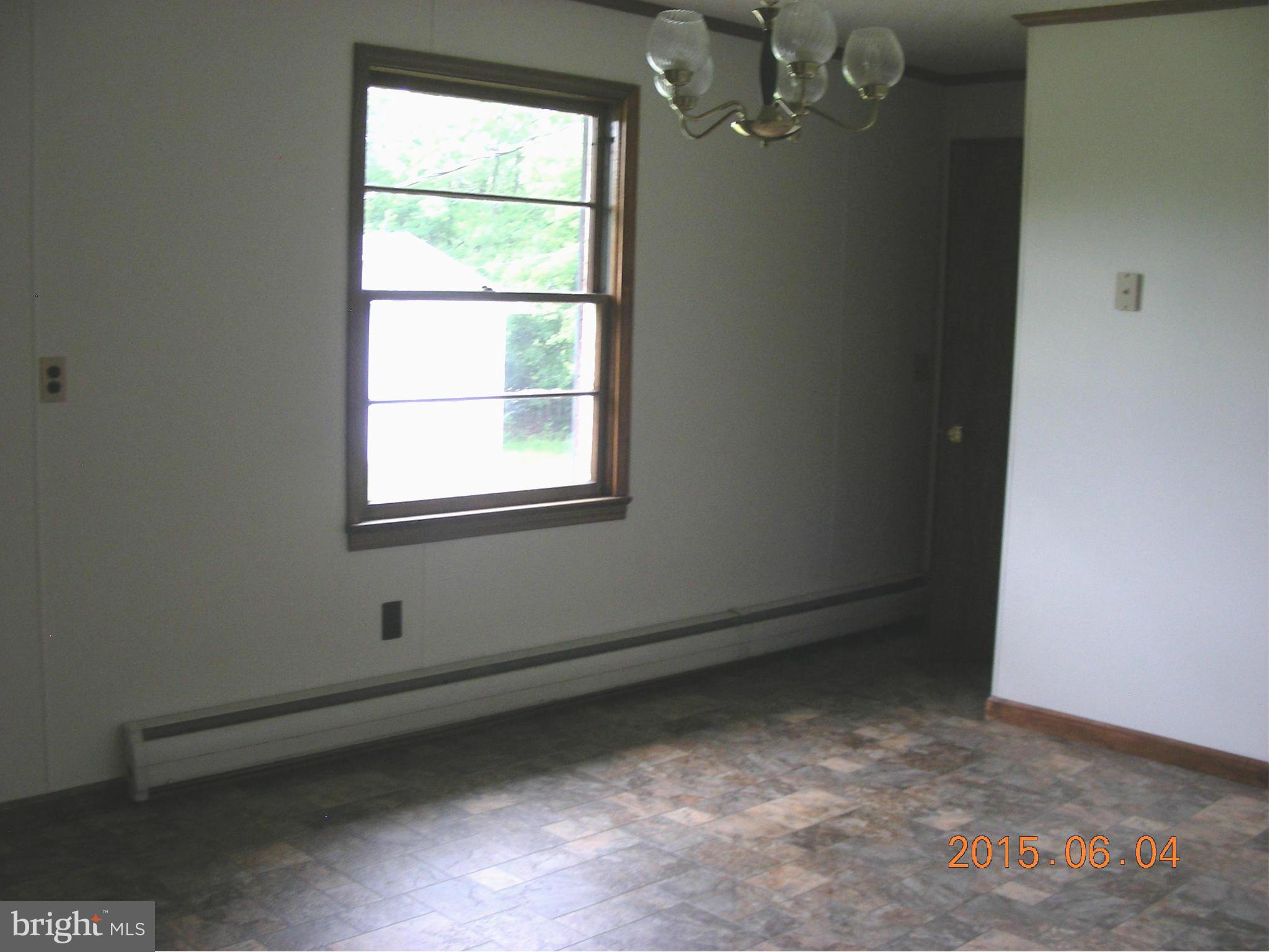 16338 Waterloo Road Amissville, VA 20106 - Photo 4 of 17 an empty room with a window