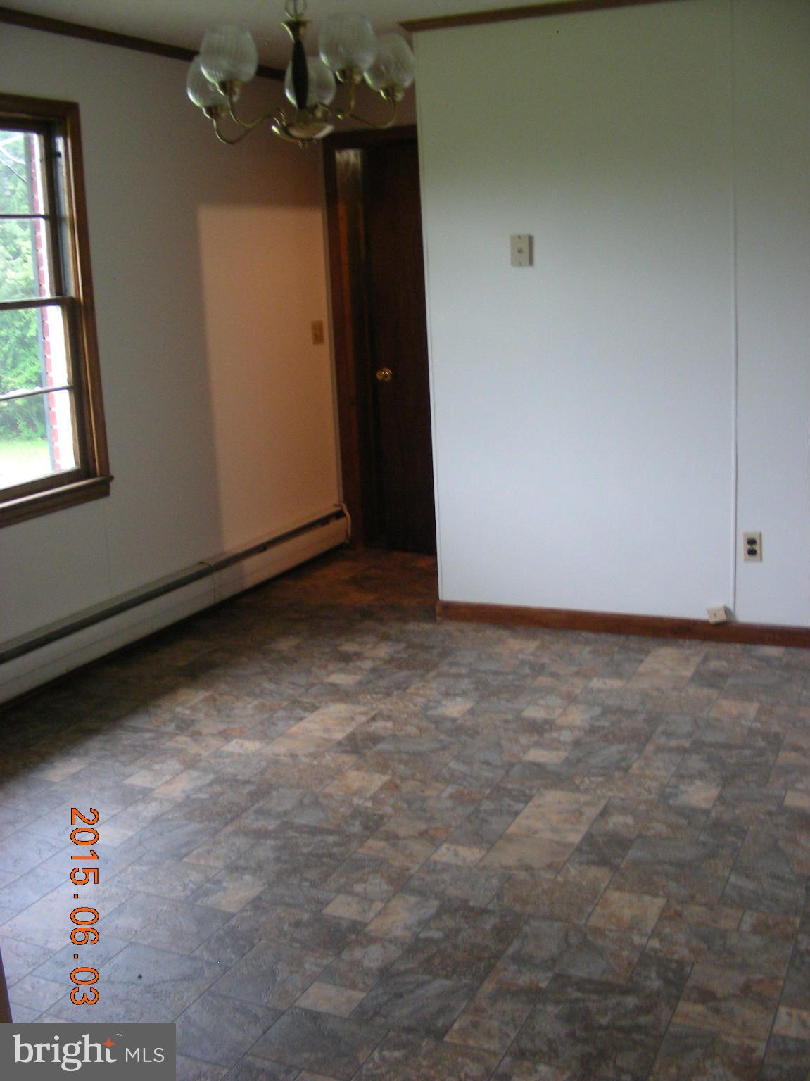 16338 Waterloo Road Amissville, VA 20106 - Photo 5 of 17 an empty room with chandelier fan