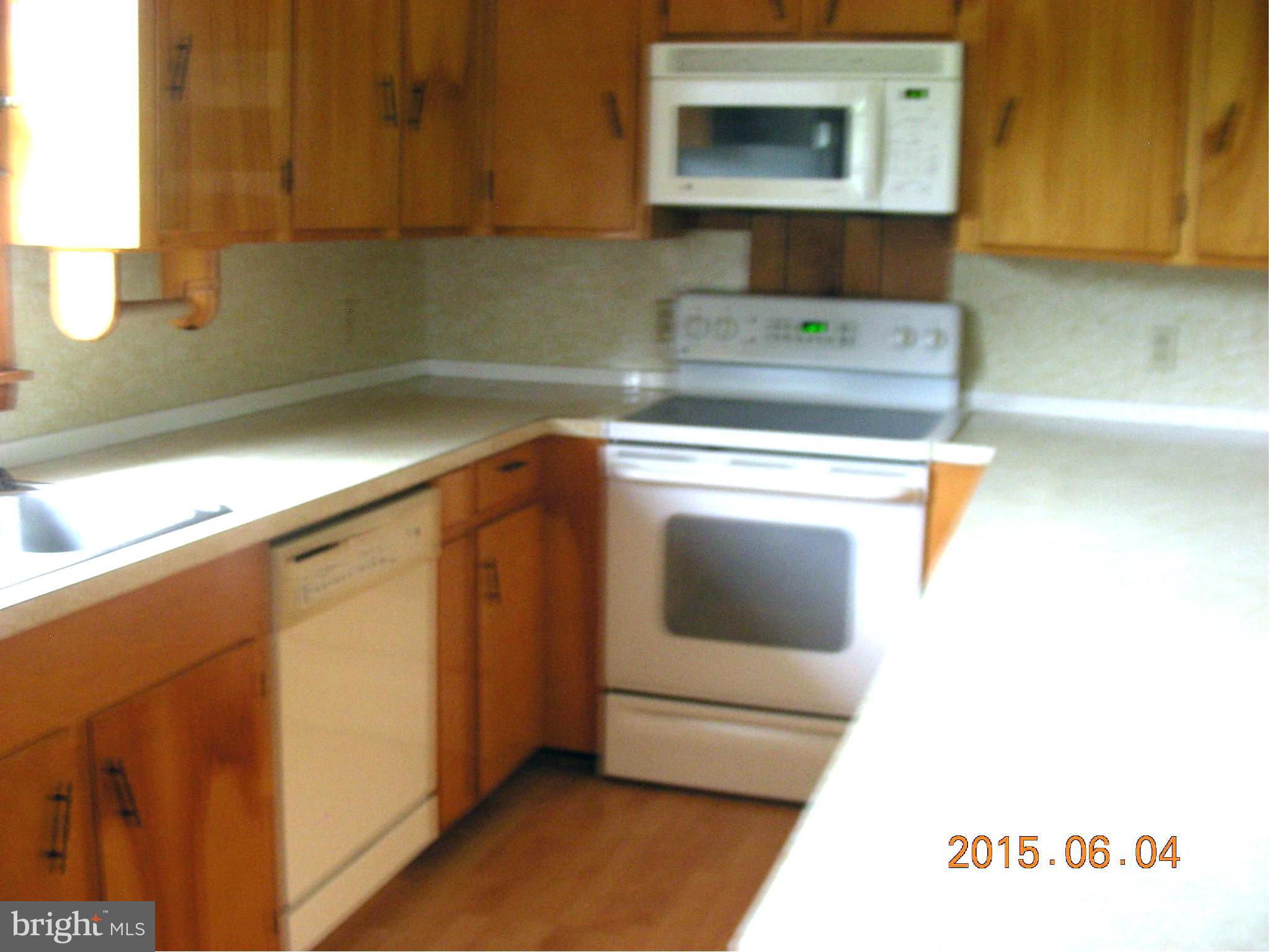 16338 Waterloo Road Amissville, VA 20106 - Photo 6 of 17 a kitchen with a sink and a microwave