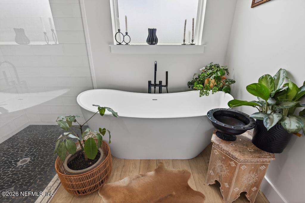 2955 Carroll Corner Road Hilliard, FL 32046 - Photo 61 of 106 a white bath tub sitting next to a white toilet