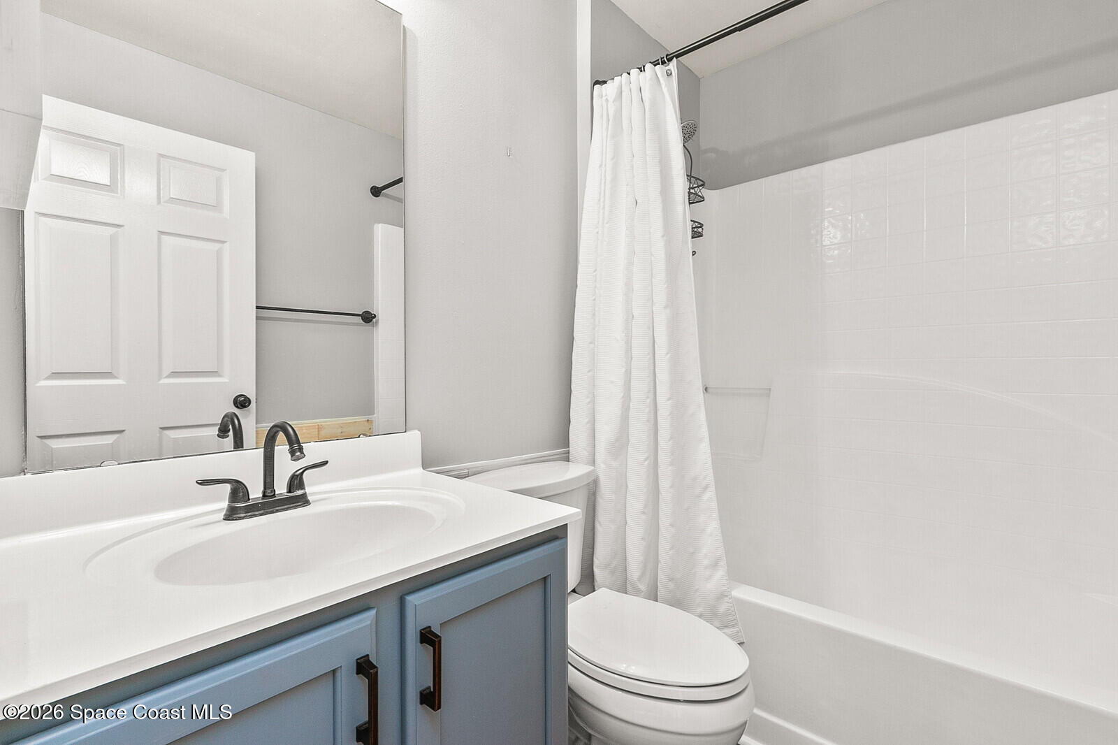 2152 Spring Creek Circle Palm Bay, FL 32905 - Photo 13 of 24 a bathroom with a sink toilet vanity and shower