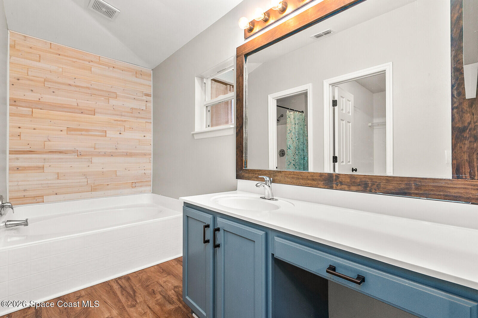 2152 Spring Creek Circle Palm Bay, FL 32905 - Photo 16 of 24 a bathroom with a sink and a bathtub