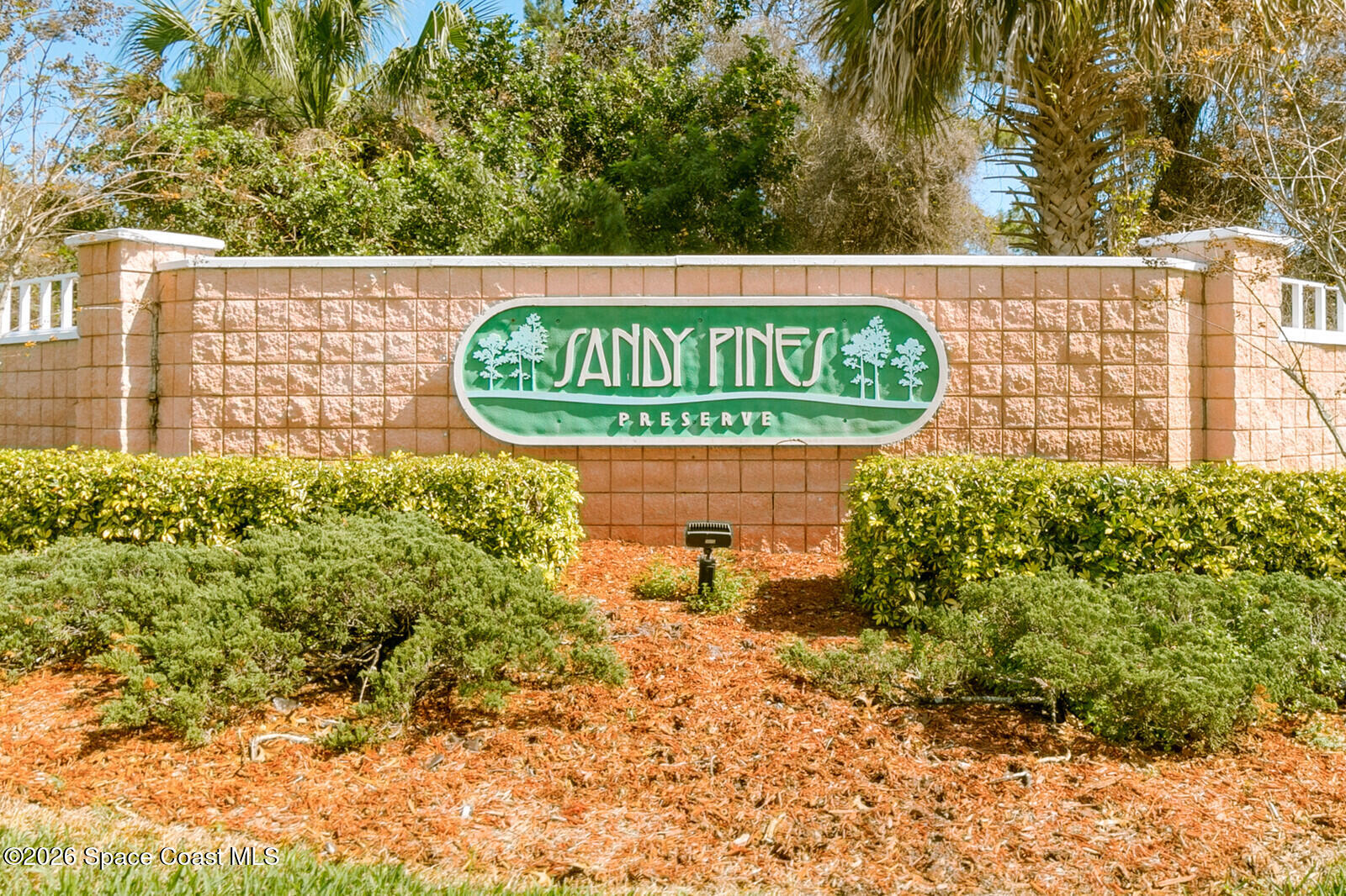 2152 Spring Creek Circle Palm Bay, FL 32905 - Photo 18 of 24 a sign that is on a brick wall