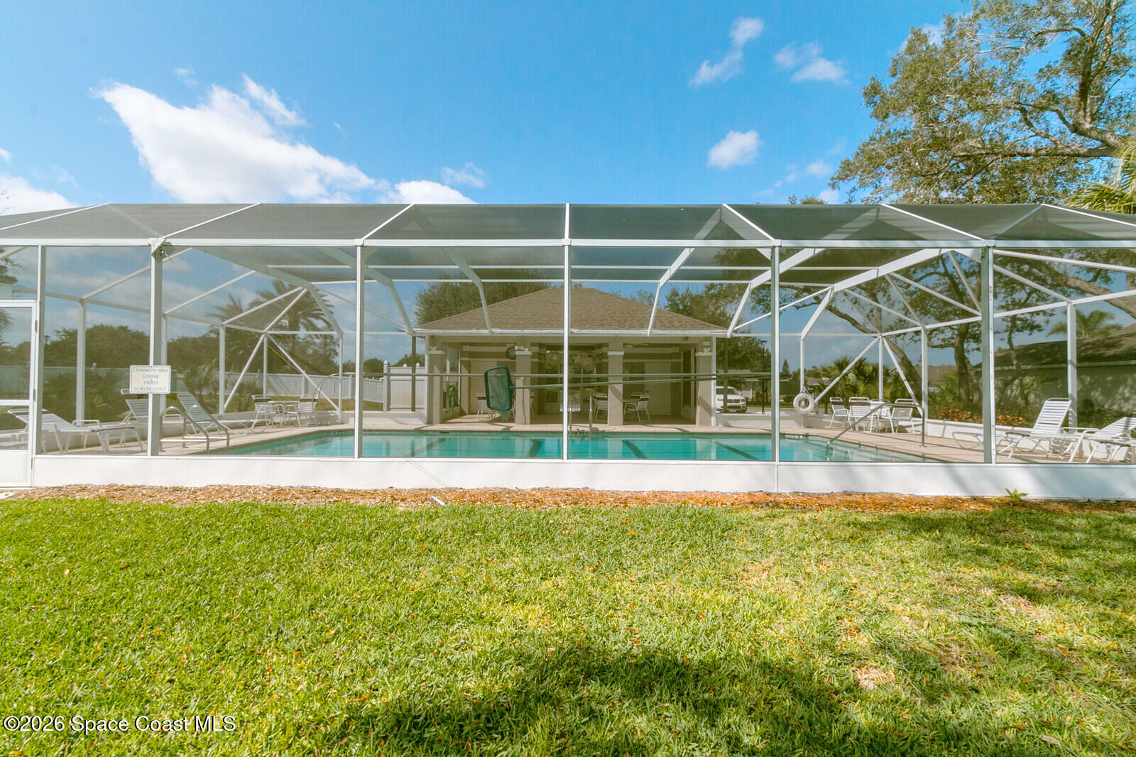 2152 Spring Creek Circle Palm Bay, FL 32905 - Photo 19 of 24 a view of a house with a yard and sitting area