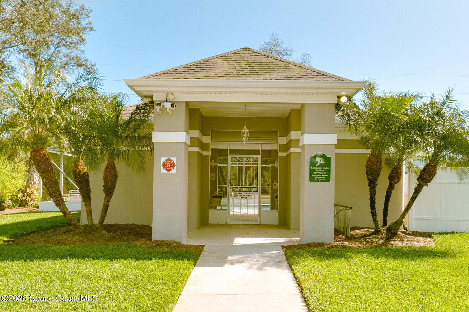 2152 Spring Creek Circle Palm Bay, FL 32905 - Photo 20 of 24 a front view of a house with a yard
