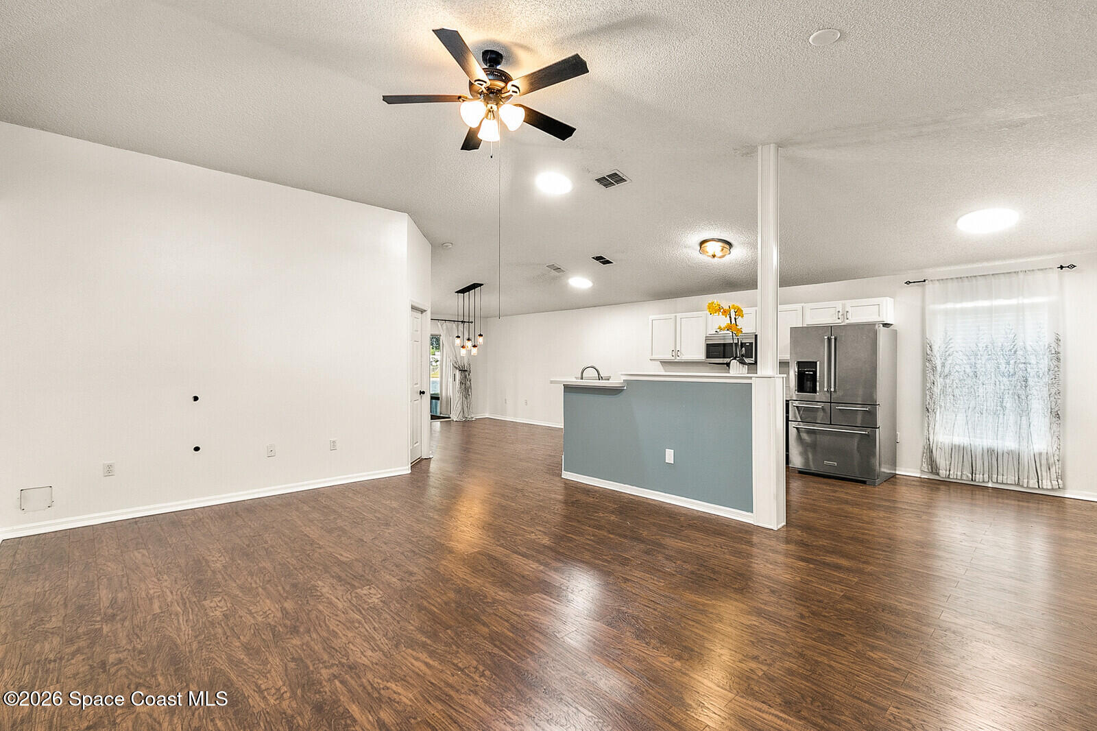 2152 Spring Creek Circle Palm Bay, FL 32905 - Photo 5 of 24 a view of a kitchen with a sink and a window