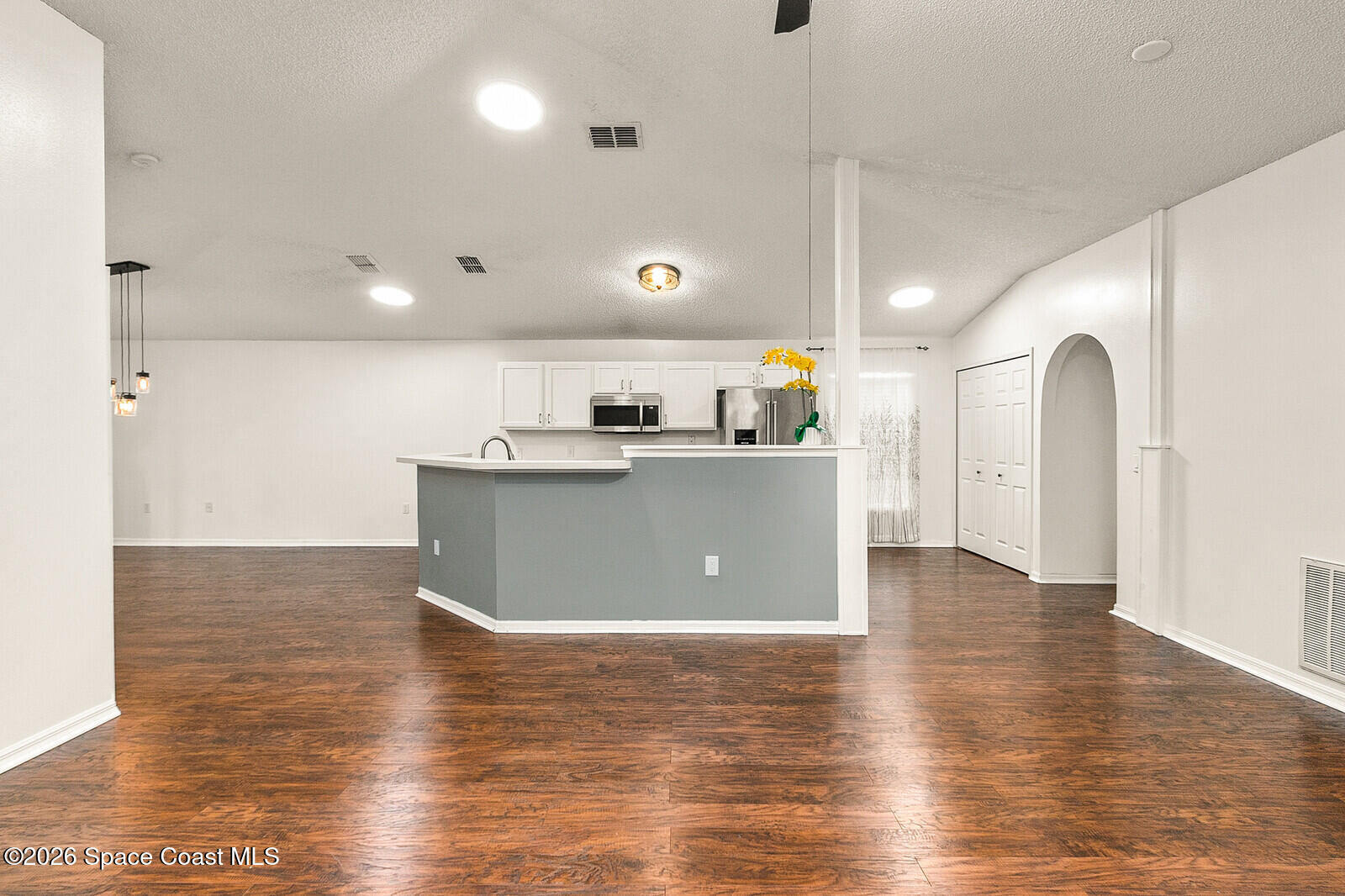 2152 Spring Creek Circle Palm Bay, FL 32905 - Photo 6 of 24 a view of kitchen with stainless steel appliances granite countertop cabinets and wooden floor