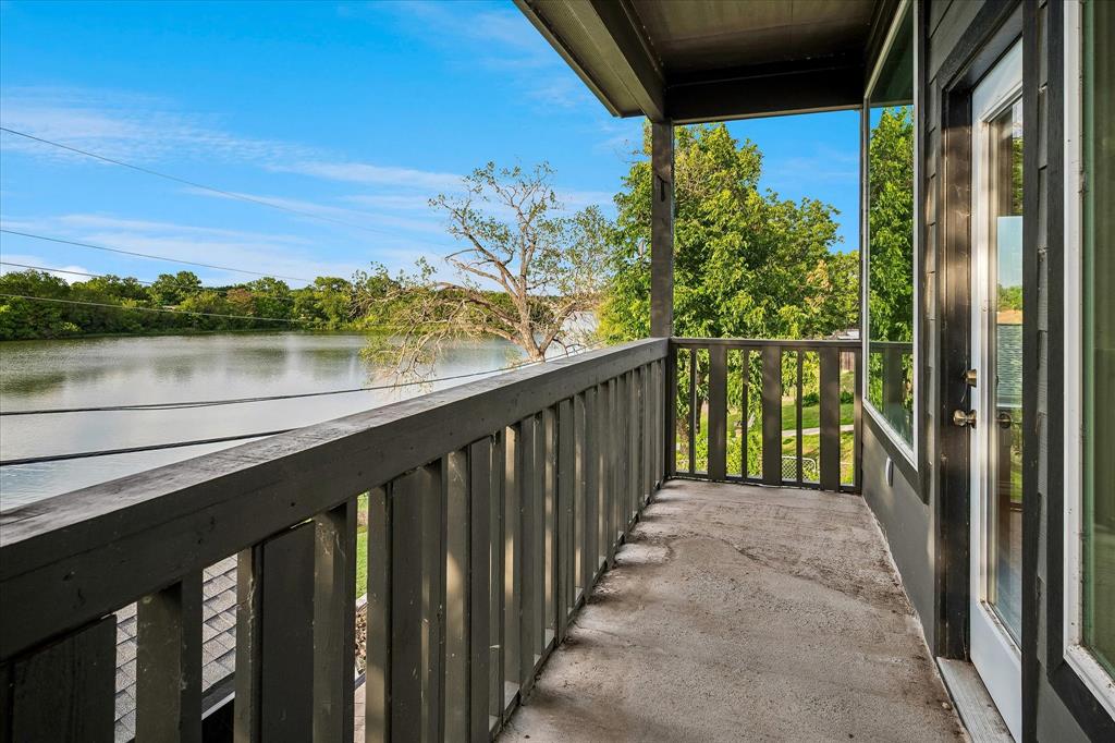 2001 Pebblebrook Trail Irving, TX 75060 - Photo 24 of 40 Balcony off of the Second Primary Bedroom overlooks the lake.