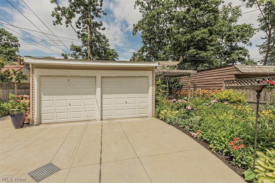 2460 Fenwick Road Cleveland, OH 44118 - Photo 35 of 35 Pristine concrete driveway, perennial garden, pergola, two-car garage and side storage space.