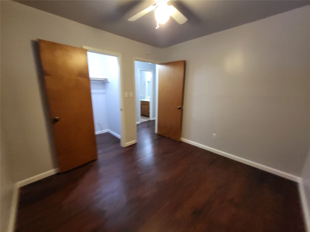 121 Harbour Lane Coldspring, TX 77331 - Photo 15 of 30 an empty room with wooden floor and windows