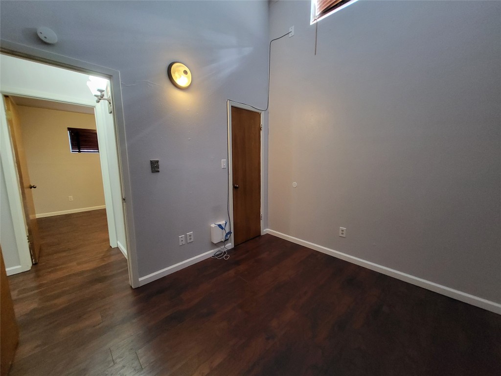 121 Harbour Lane Coldspring, TX 77331 - Photo 16 of 30 an empty room with wooden floor and windows