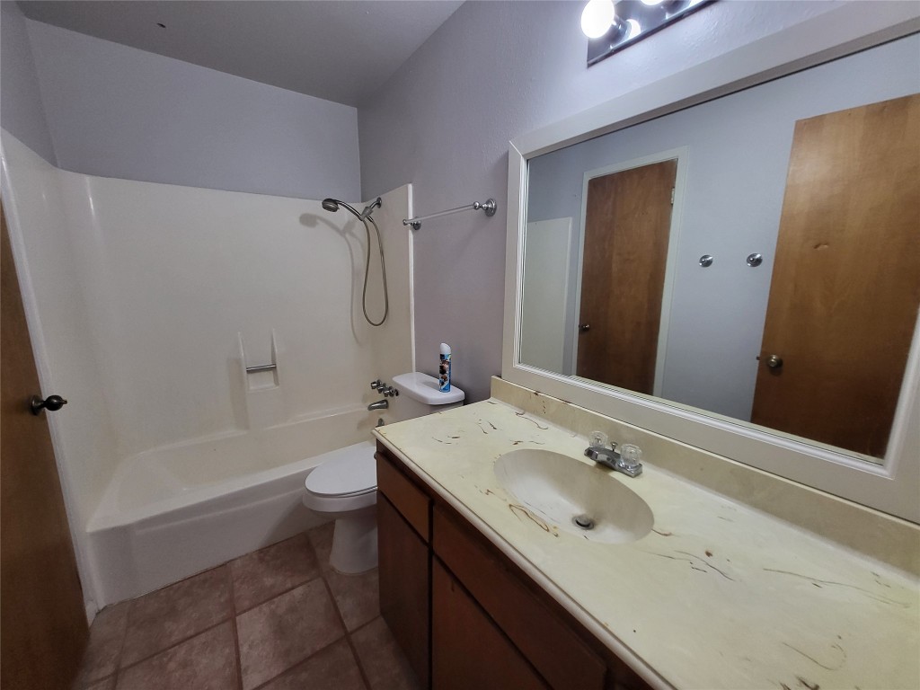 121 Harbour Lane Coldspring, TX 77331 - Photo 23 of 30 a bathroom with a sink a toilet and shower