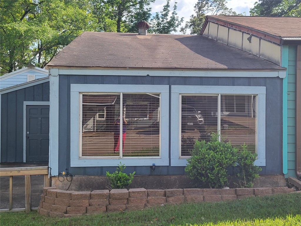 121 Harbour Lane Coldspring, TX 77331 - Photo 26 of 30 a view of a house with a yard and sitting area
