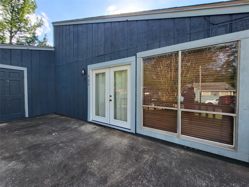 121 Harbour Lane Coldspring, TX 77331 - Photo 4 of 30 a view of backyard with sliding door and wooden fence