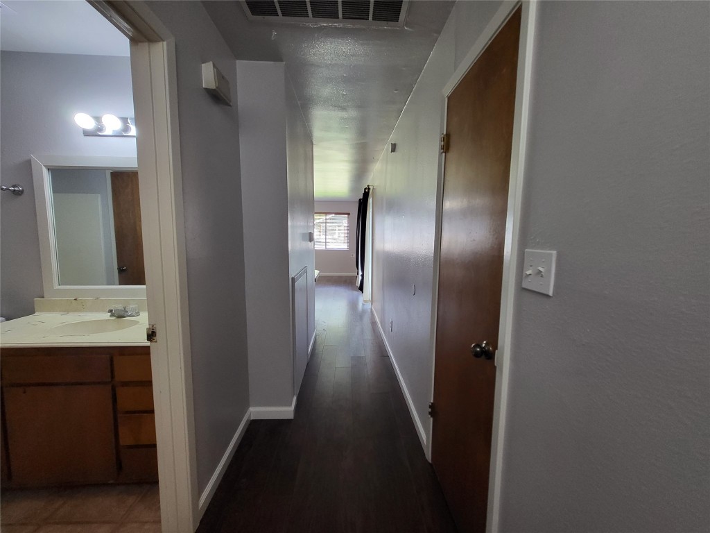 121 Harbour Lane Coldspring, TX 77331 - Photo 7 of 30 a view of a hallway with wooden floor