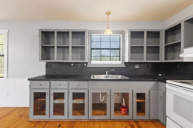 a kitchen with a sink and cabinets