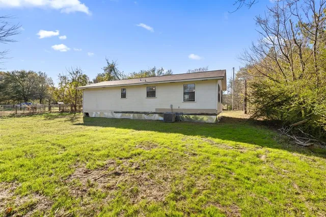 a front view of a house with yard