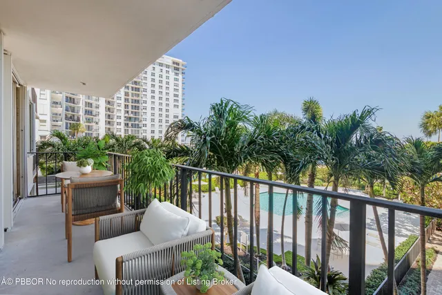 a view of a balcony with chairs