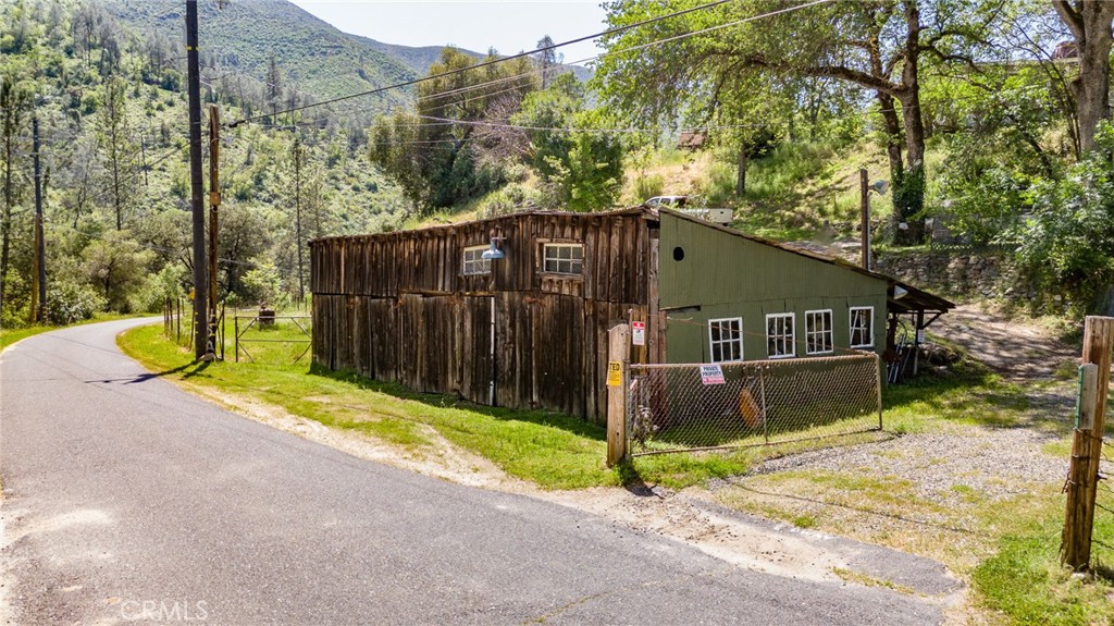 10049 Incline Road El Portal, CA 95318 - Photo 30 of 44 a side view of a house with a yard