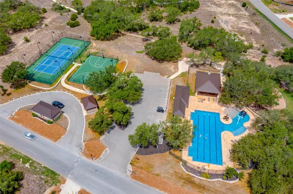 a view of yard with swimming pool and seating