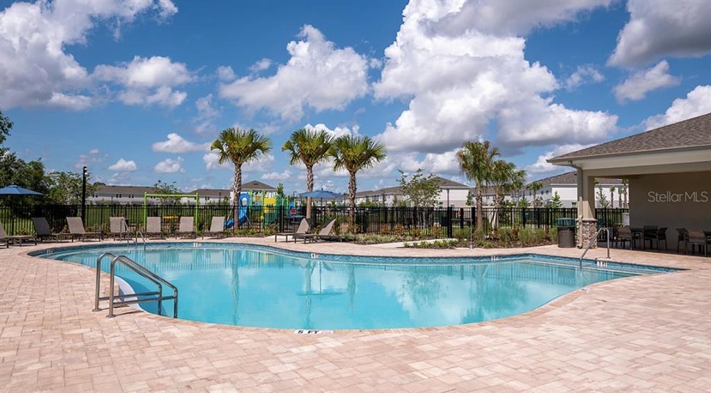 13228 Stable Place Parrish, FL 34219 - Photo 27 of 28 a view of a swimming pool with outdoor seating