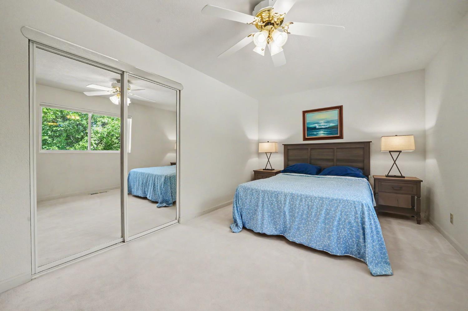 18299 West Clinton Road Jackson, CA 95642 - Photo 38 of 56 a bedroom with a bed and a chandelier
