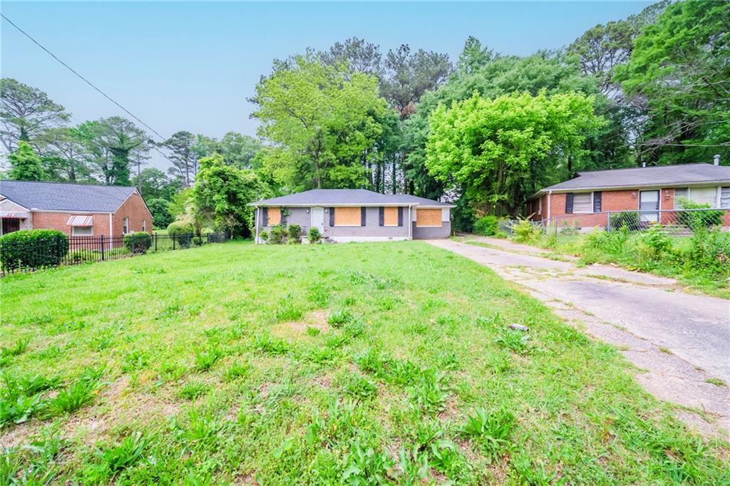 1753 Thomas Terrace Decatur, GA 30032 - Photo 1 of 1 a view of an house with backyard space and garden
