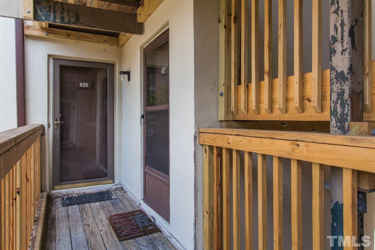 627 Pine Ridge Place, Unit NONE Raleigh, NC 27609 - Photo 2 of 21 a view of a wooden door with a door