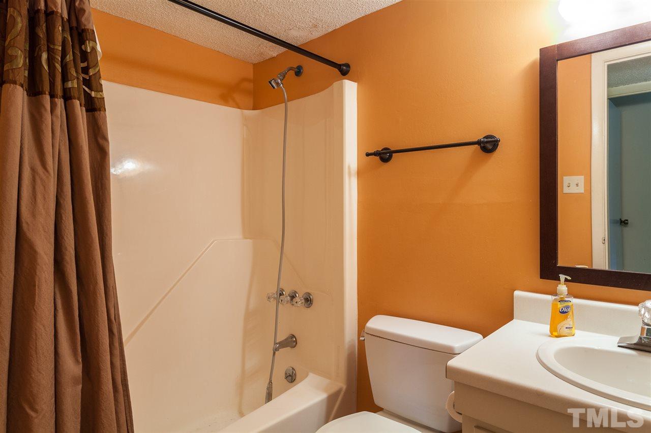 627 Pine Ridge Place, Unit NONE Raleigh, NC 27609 - Photo 16 of 21 a bathroom with a shower and a toilet