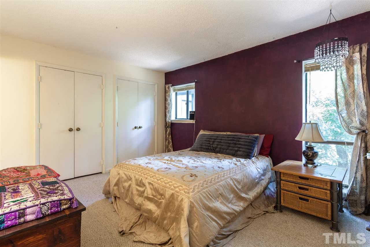 627 Pine Ridge Place, Unit NONE Raleigh, NC 27609 - Photo 17 of 21 a bedroom with a bed and a window