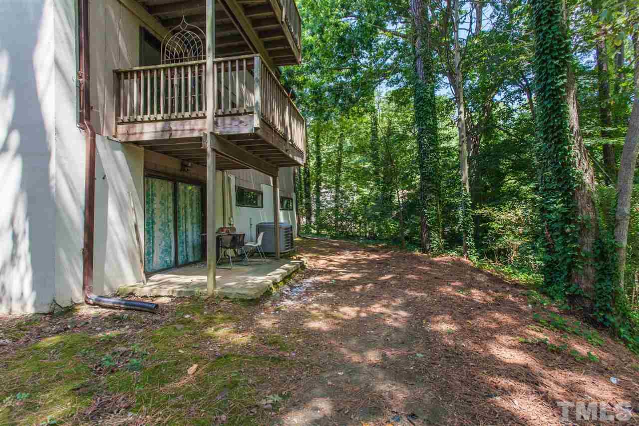 627 Pine Ridge Place, Unit NONE Raleigh, NC 27609 - Photo 4 of 21 a backyard of a house with table and chairs