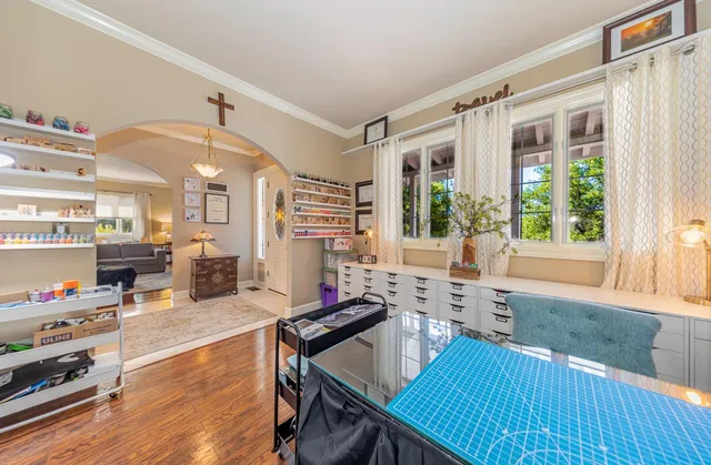 a kitchen with stainless steel appliances a refrigerator stove and white cabinets
