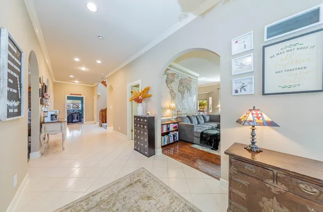 a living room with furniture and large window
