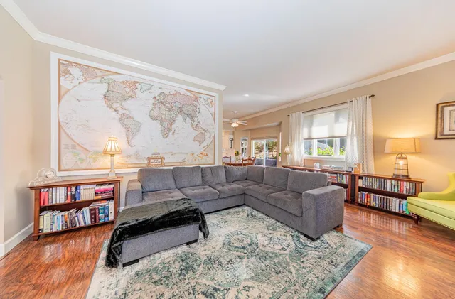 a spacious bedroom with a bed and a dresser