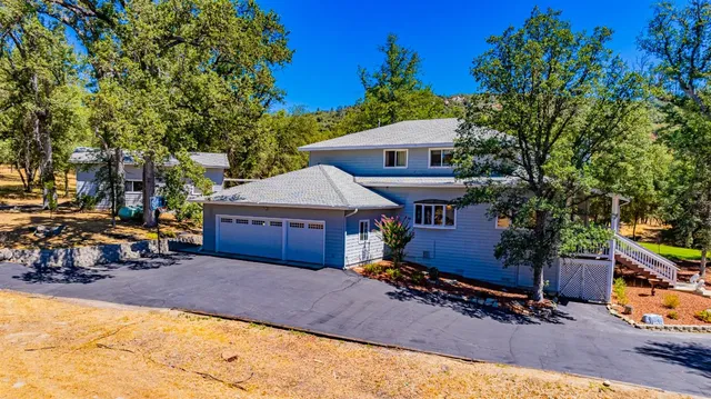 a dining room with furniture a rug and a chandelier