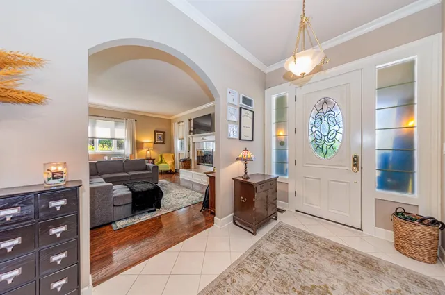 a dining room with furniture and window