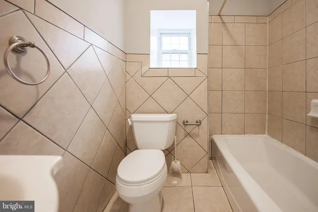 a bathroom with a toilet and a sink