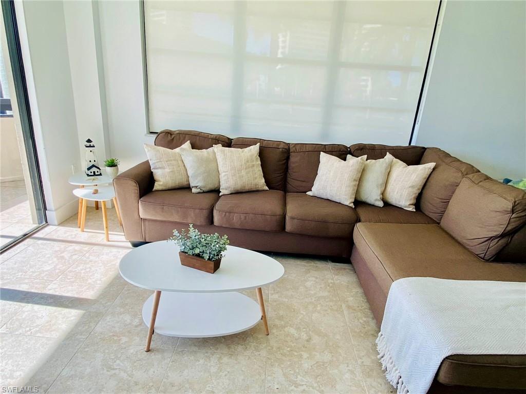 a living room with furniture and a rug