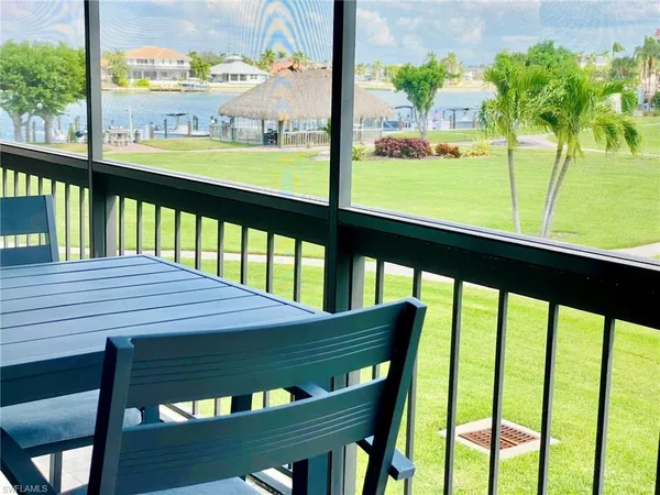 a view of a two chairs in the balcony