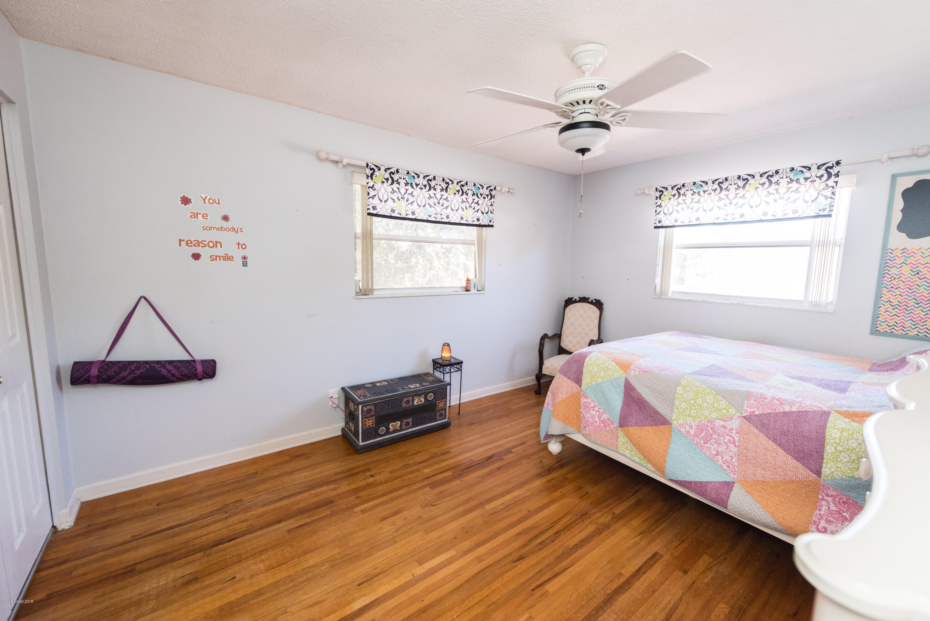 1023 Palmer Road Rockledge, FL 32955 - Photo 19 of 24 a bedroom with a bed and a ceiling fan
