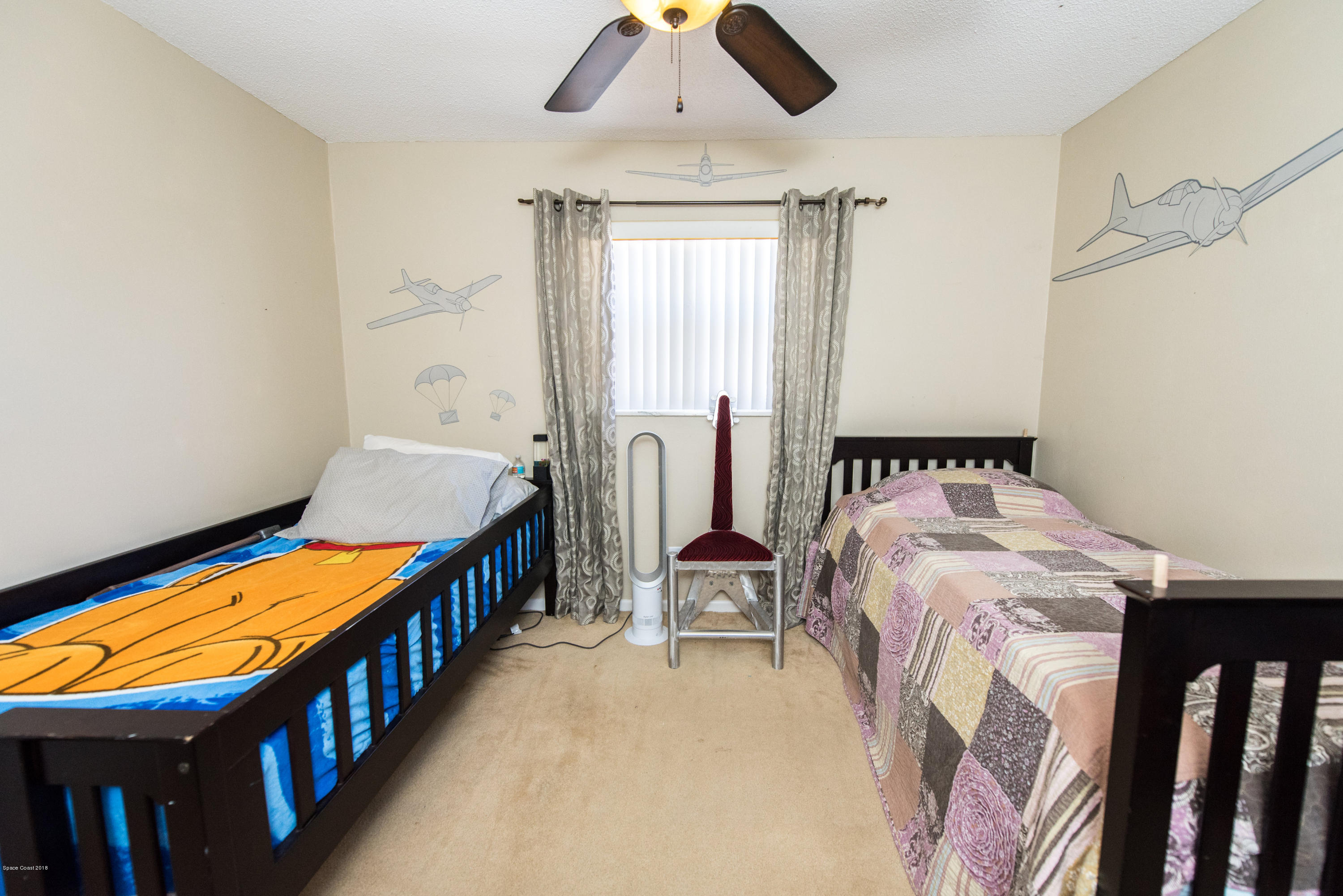 1023 Palmer Road Rockledge, FL 32955 - Photo 20 of 24 a bedroom with furniture and a window