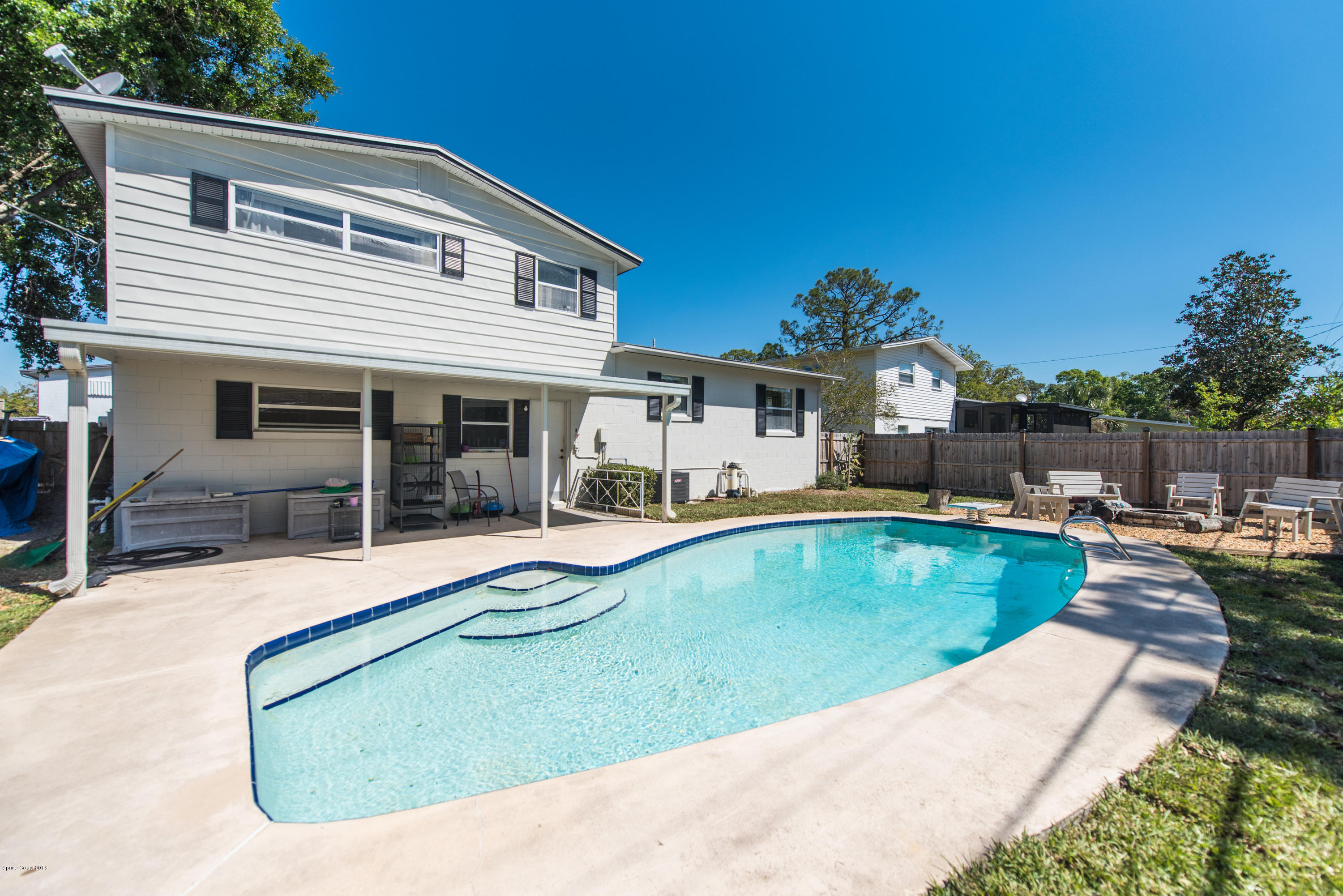 1023 Palmer Road Rockledge, FL 32955 - Photo 24 of 24 a view of a house with swimming pool and porch